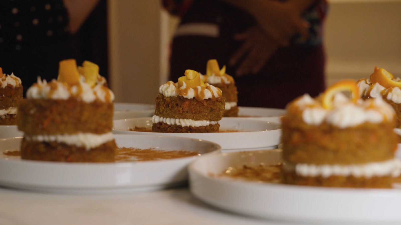 Individual carrot cakes layered with cream and finished with candied orange.